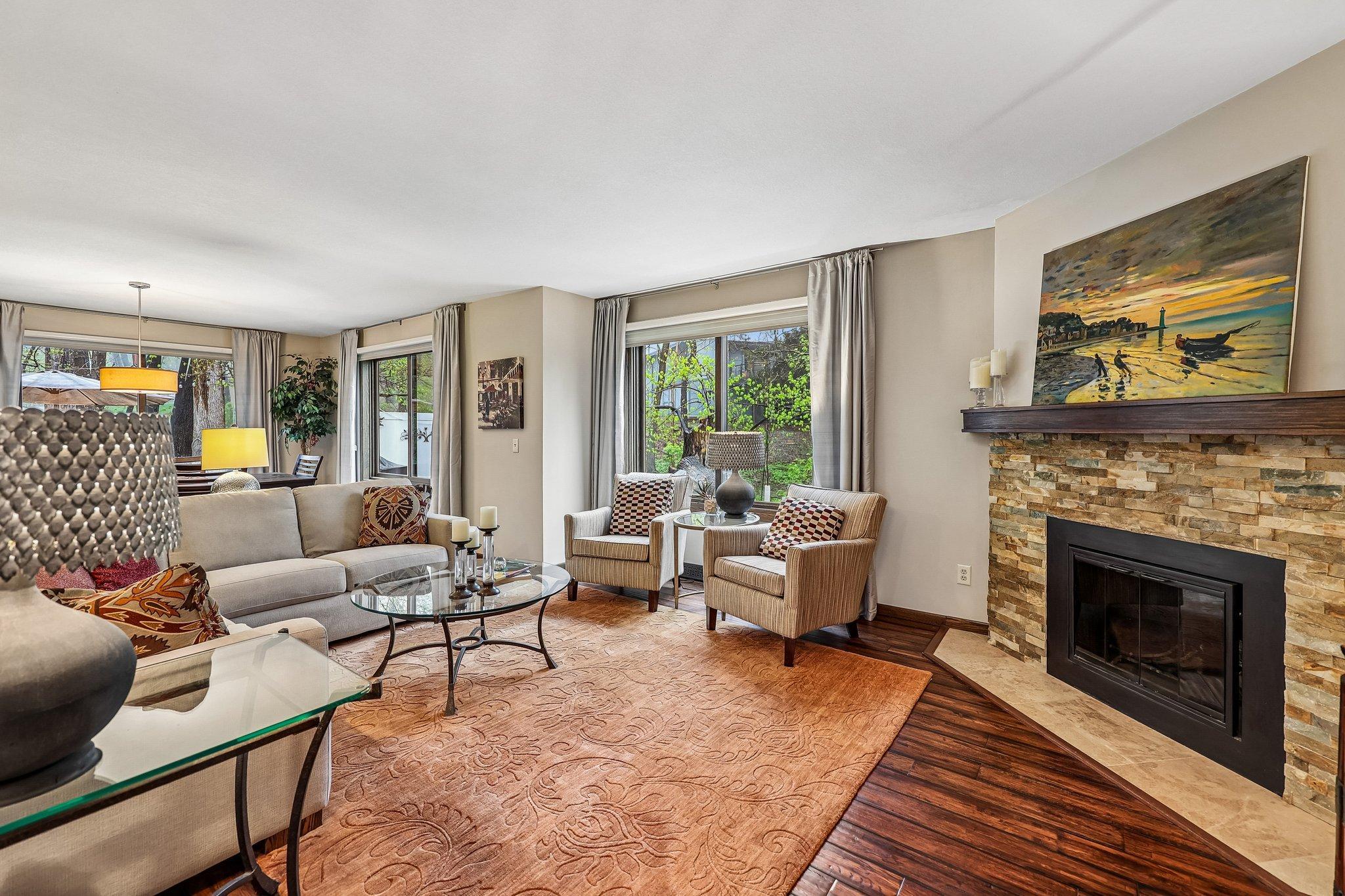 Living room with hardwood floors and gas fireplace