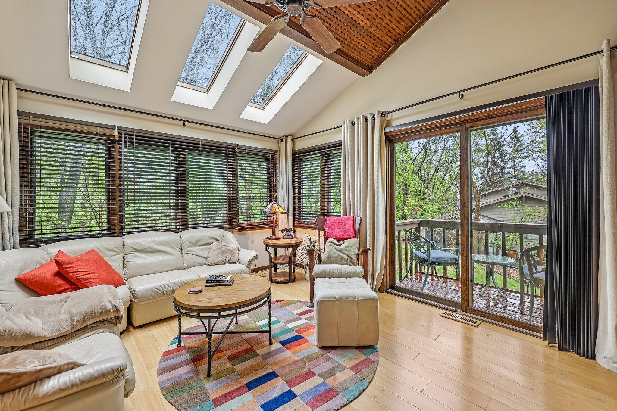 A glimpse of the Primary Suite sitting room with private balcony with lake views!