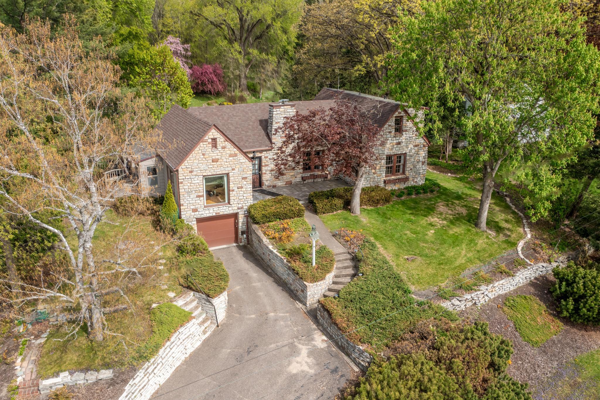 Built in 1939, loved by one family for over half a century, this stone bungalow is now waiting for you.