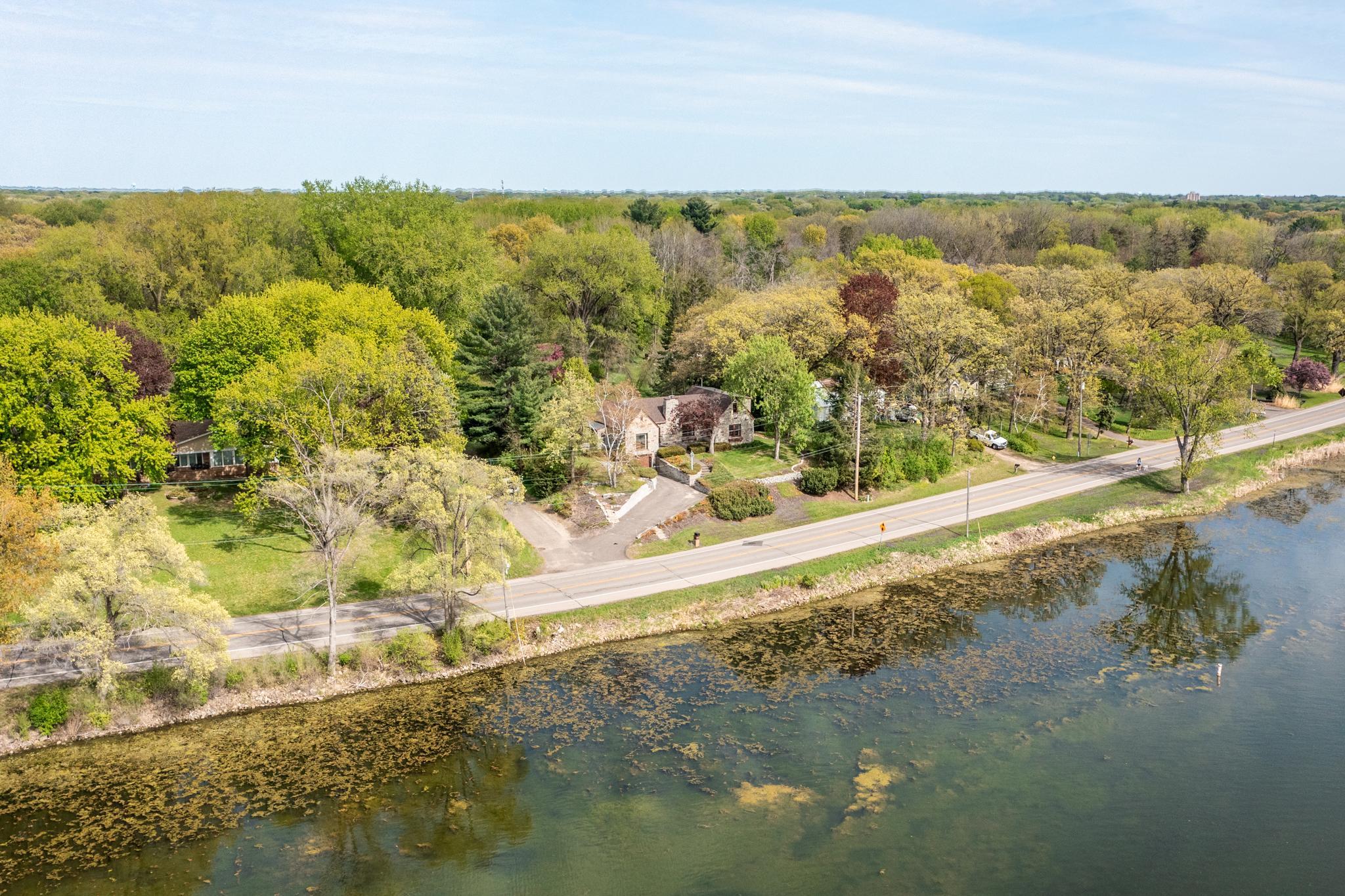 1 acre lot directly across from Lake Gervais, this home offers sweeping lake views from multiple rooms without the cost of lakefront ownership