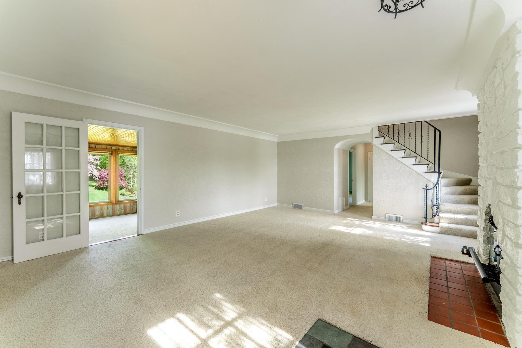 As you enter through the front door, the spacious iving room welcomes you.
