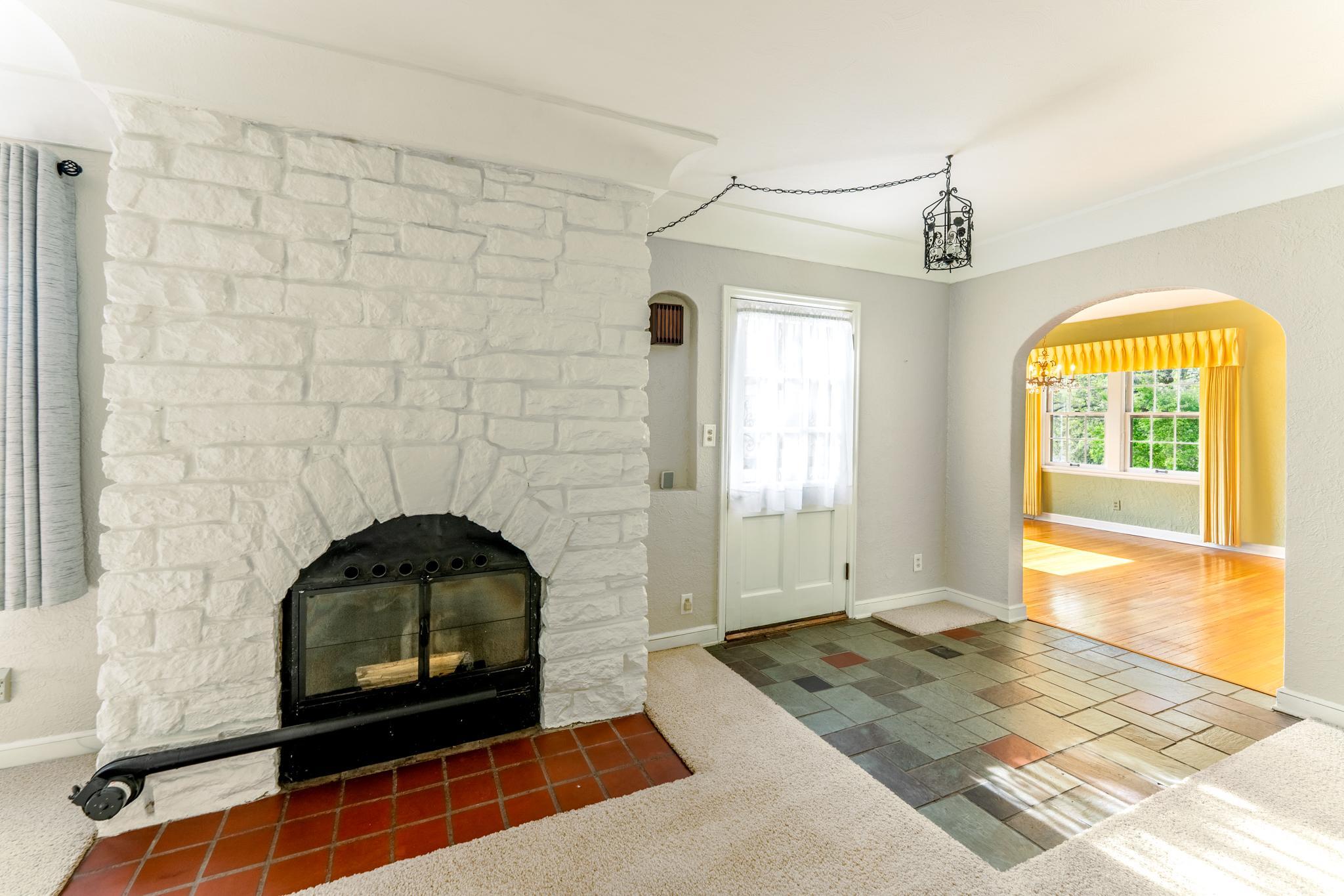 Wood burning stove has a recirculating blower for additional heat in the home.