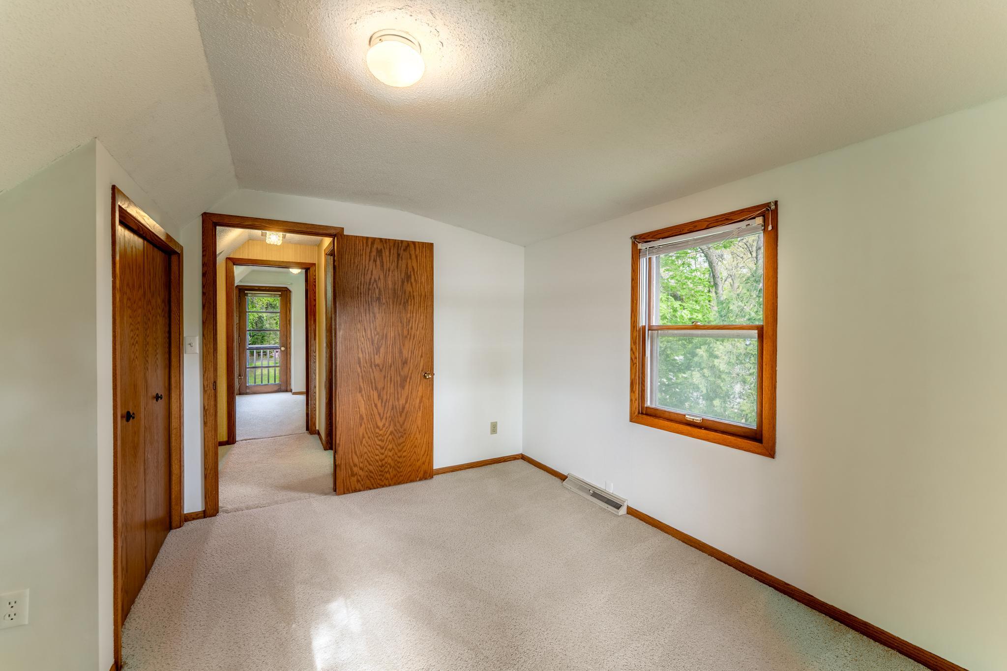 Upper level bedroom looking towards the hallway. (BR3)