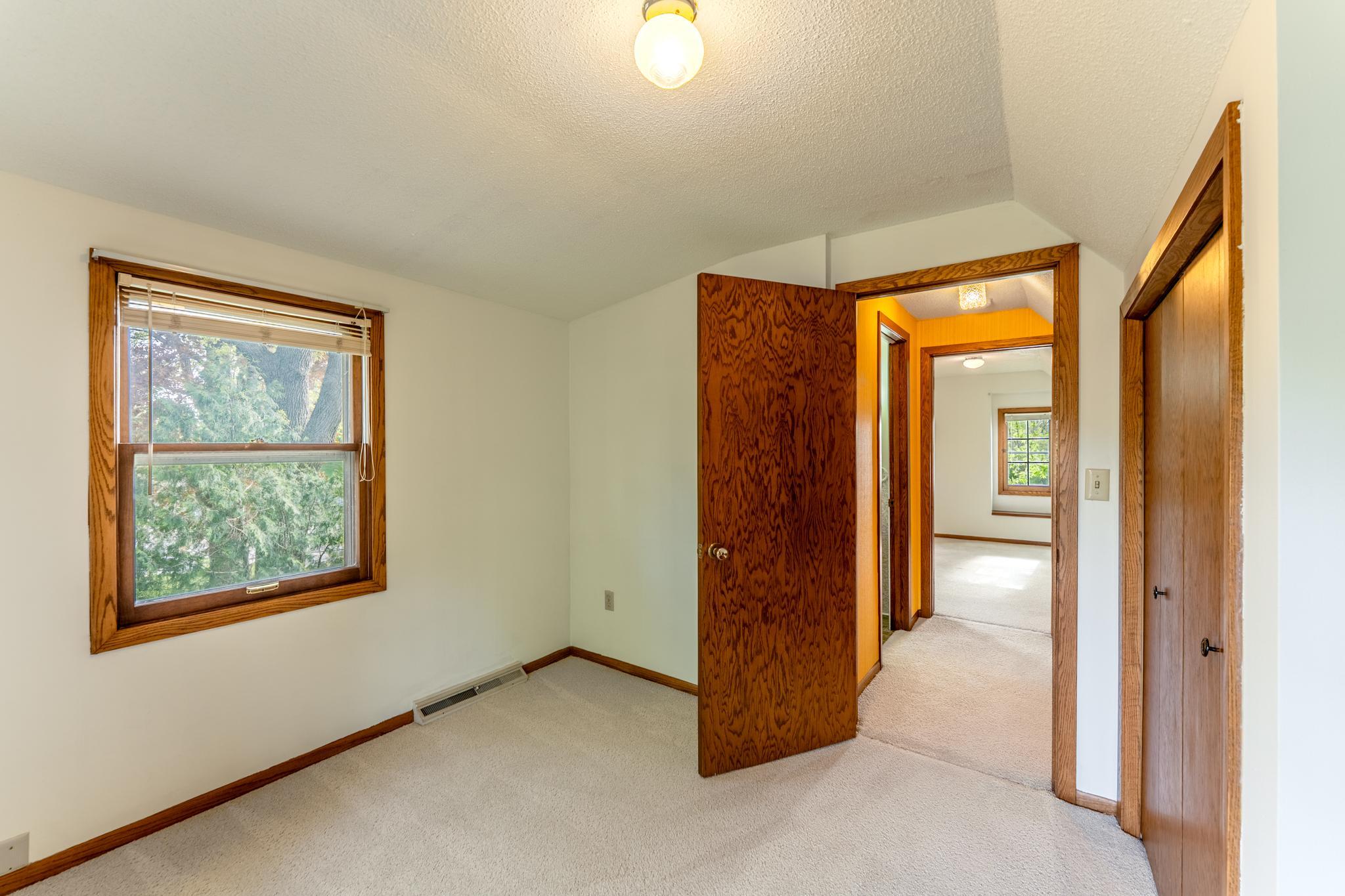 View of the other upper level bedroom looking toward the hallway. (Bedroom4)