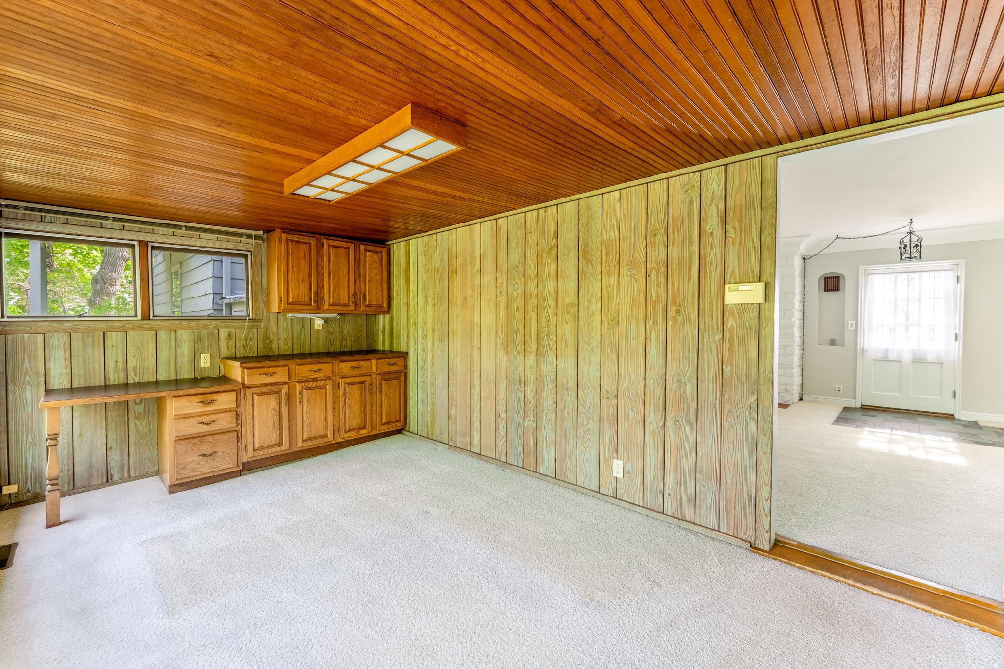 Sunroom was built to optimize the views of the backyard's gardens. Built in desks and storage make it a great home office option.