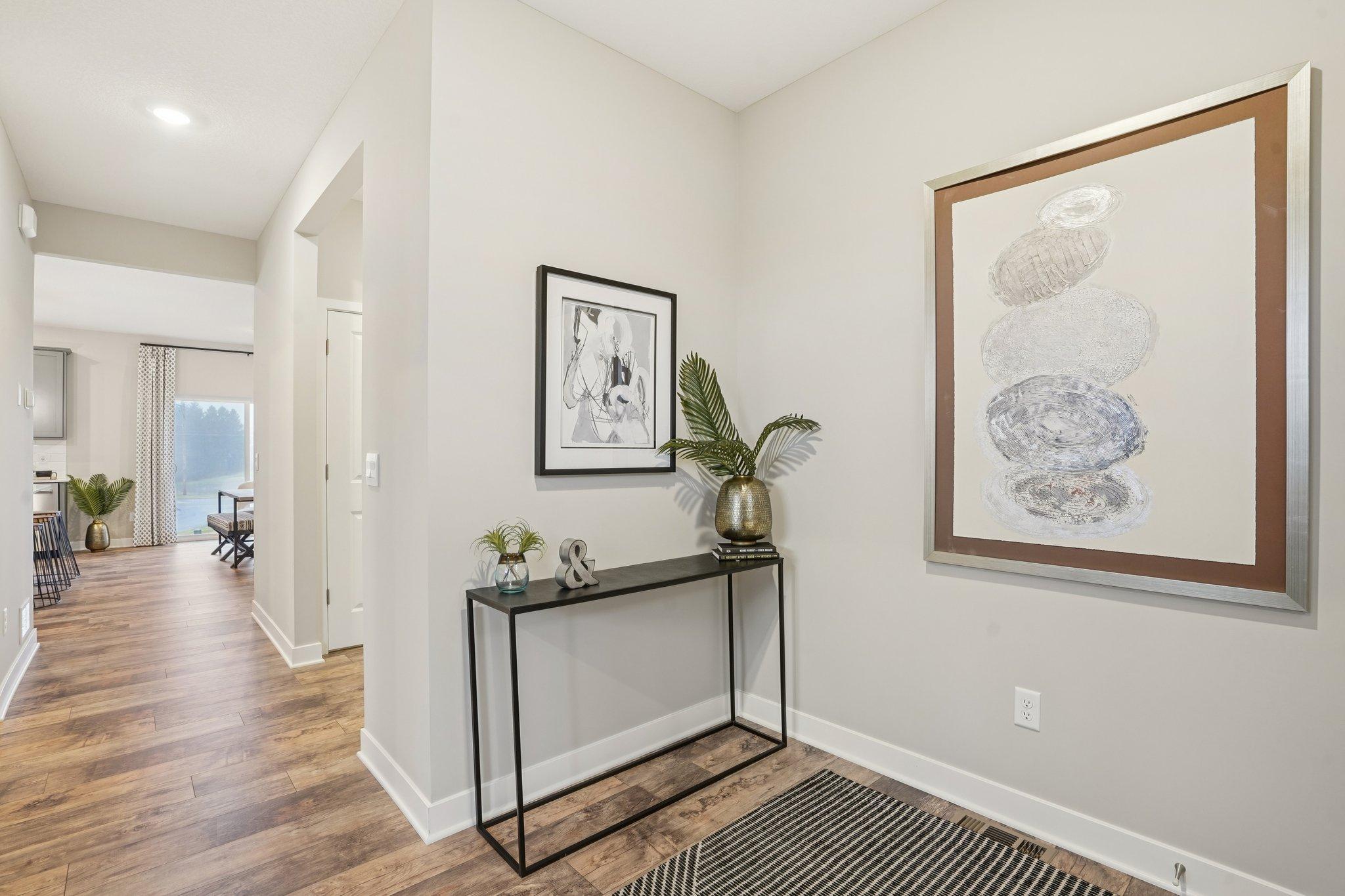 This home features an open and airy foyer perfect for welcoming guests into your new home. Photo of model home, finishes will vary.
