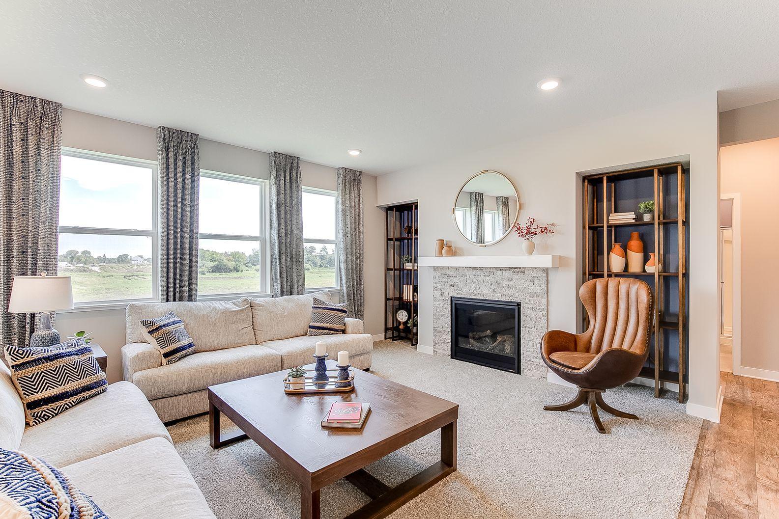 There's plenty of room for a sectional or large couches, and side chairs in this living room! Photo of model home, colors and finishes are similar.