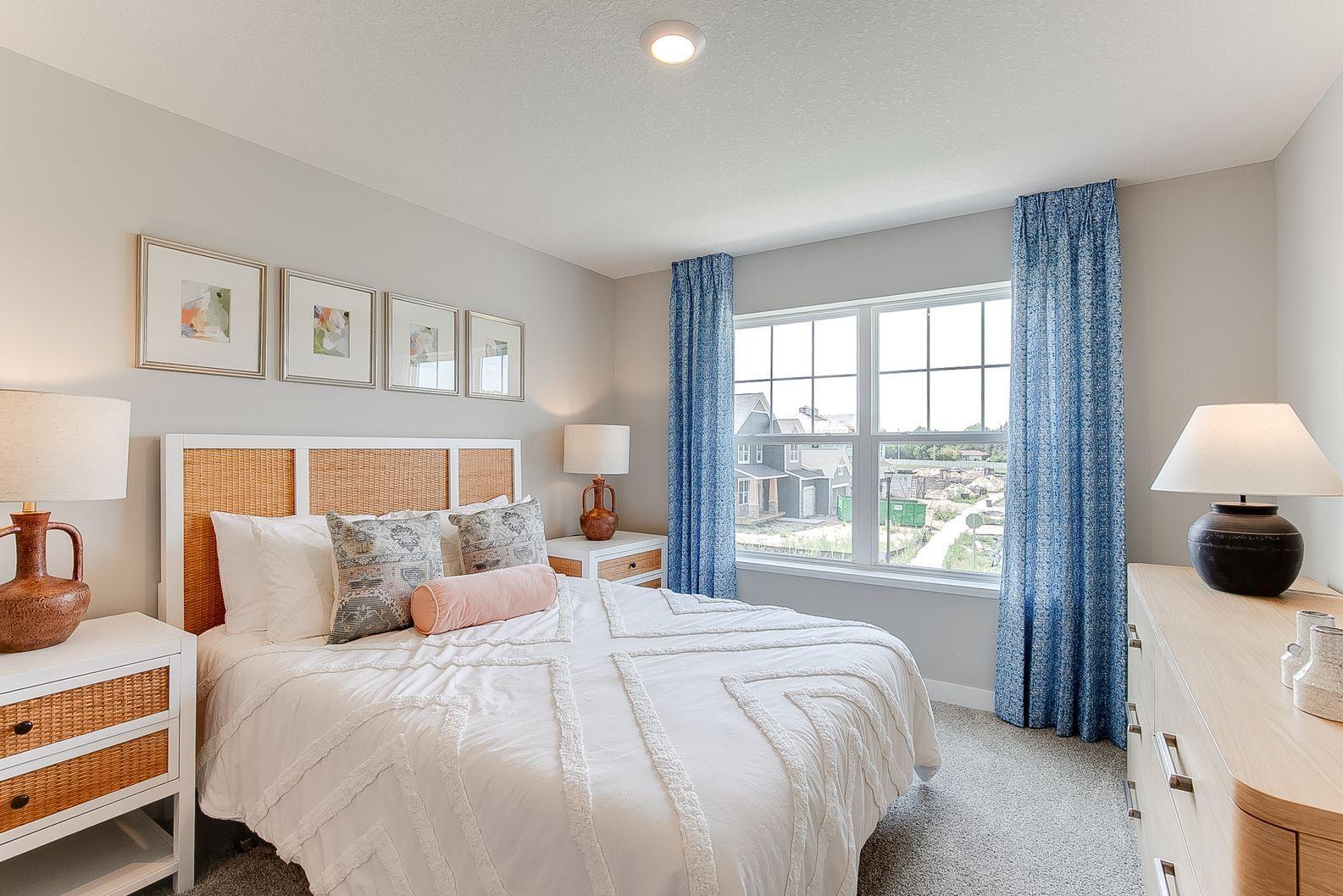 Another gorgeous secondary bedroom. Photo of model, colors and finishes are similar.