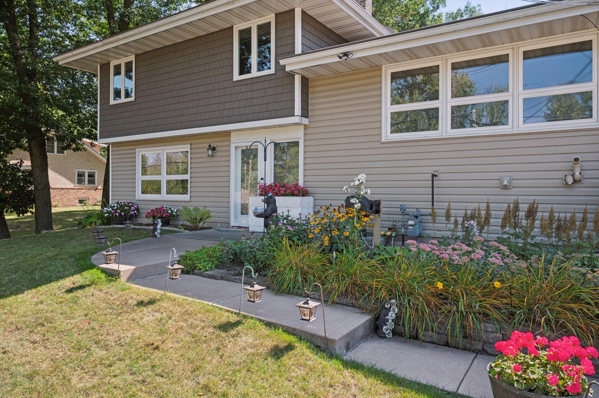 The front steps lead you into the home. Note the newer siding.