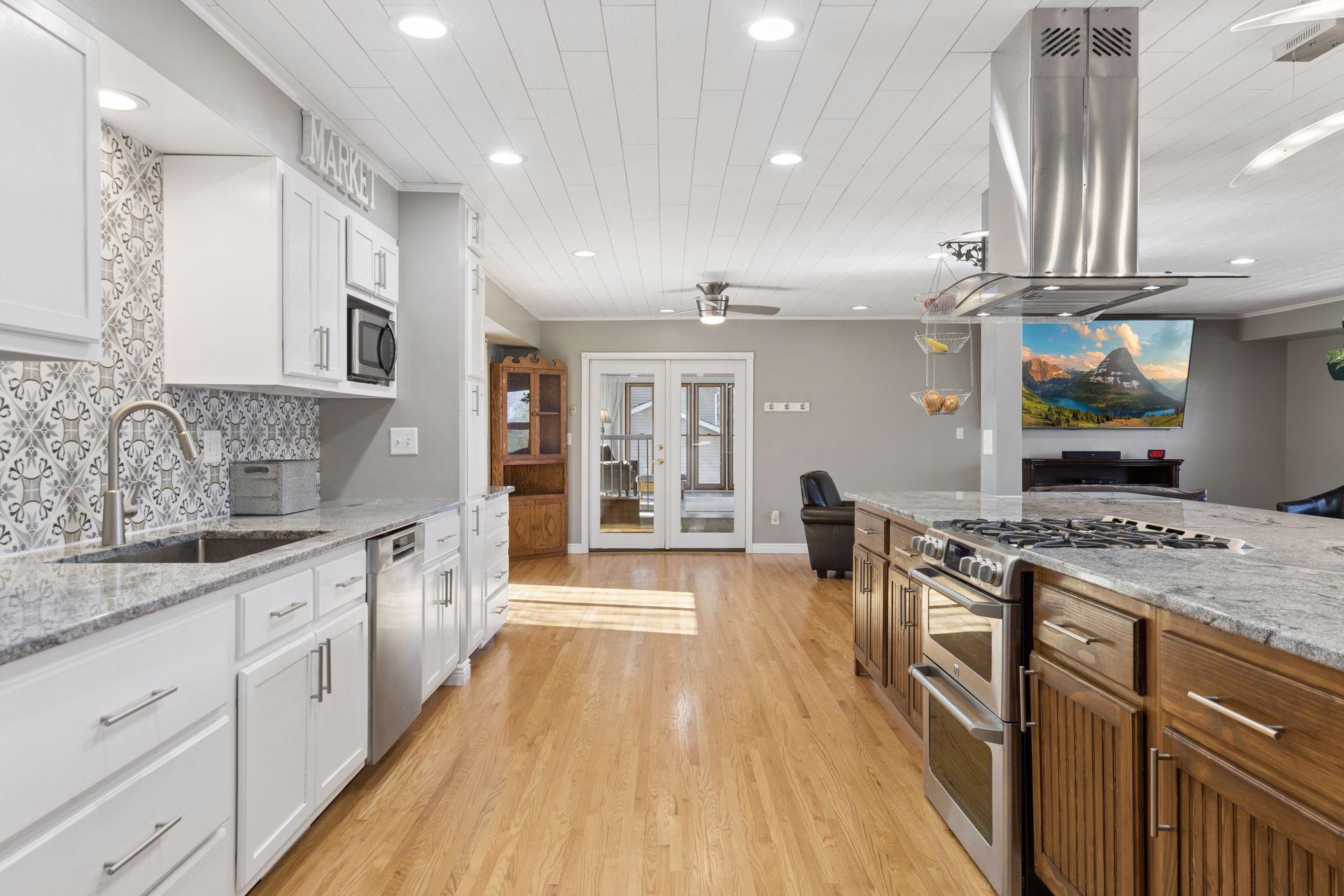 The kitchen also leads to access to the deck area and to the porch.
