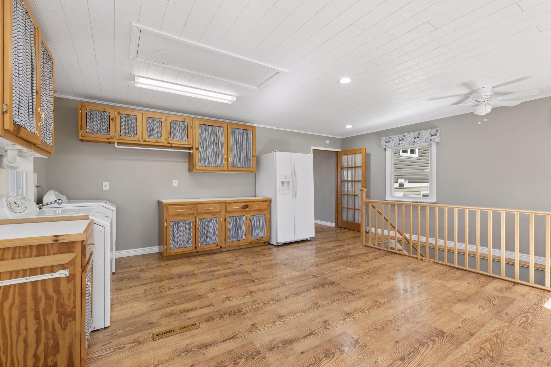 This room is perfect for hobbies, TV, office, home school... the possibilities are endless. The stairs here lead down to a non conforming bedroom and a full bathroom.