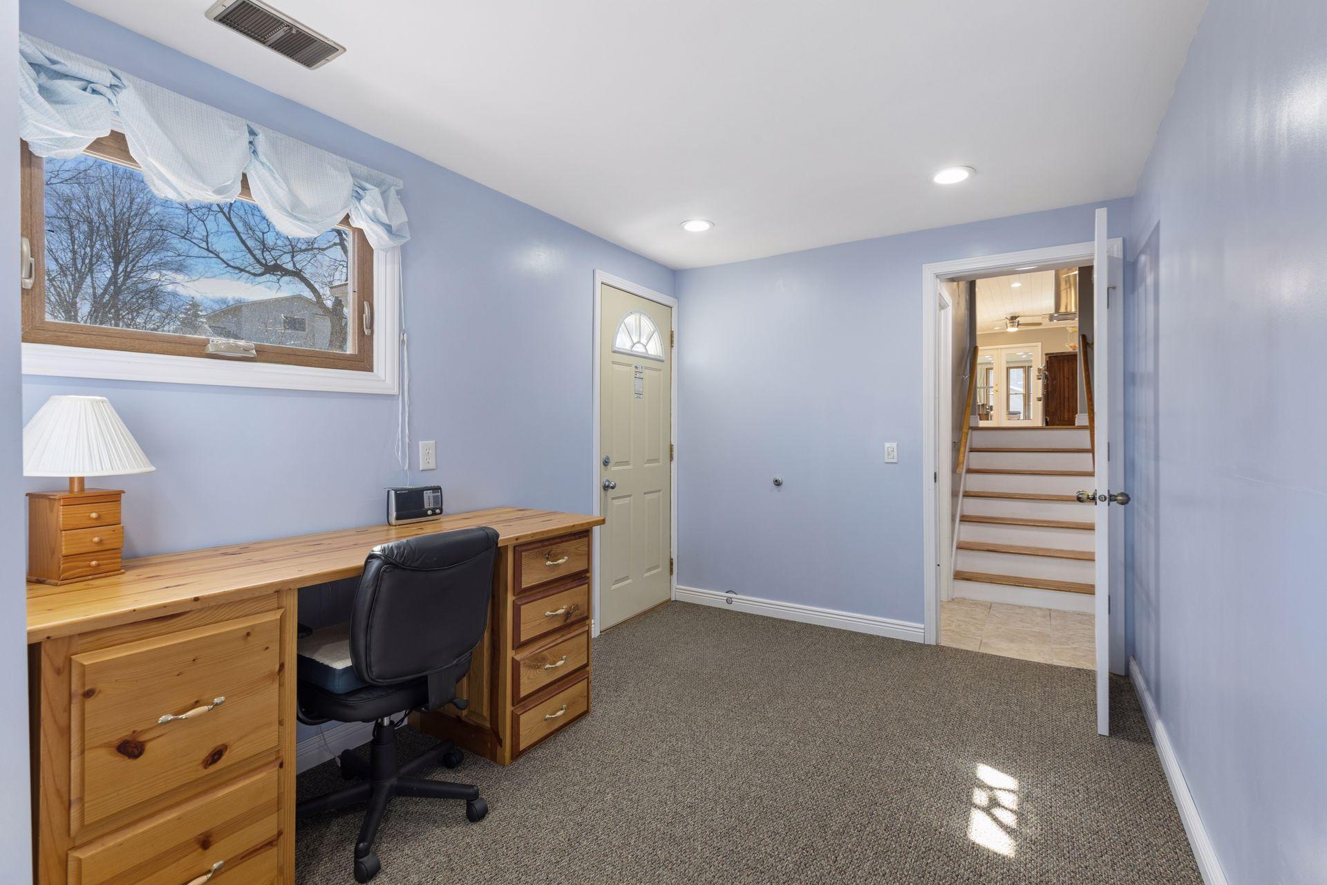 This bedroom has access out to the fenced in area of the yard.
