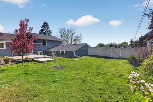Large flat backyard with beautiful landscaping