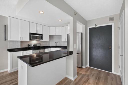 Photo for 401 S 1st Street, 518, Minneapolis, MN 55401 - listing #7064656 The breakfast bar is the perfect spot to enjoy a meal, catch up on work, and sip your morning coffee.