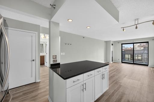 The kitchen flows easily into the informal dining area and living room
