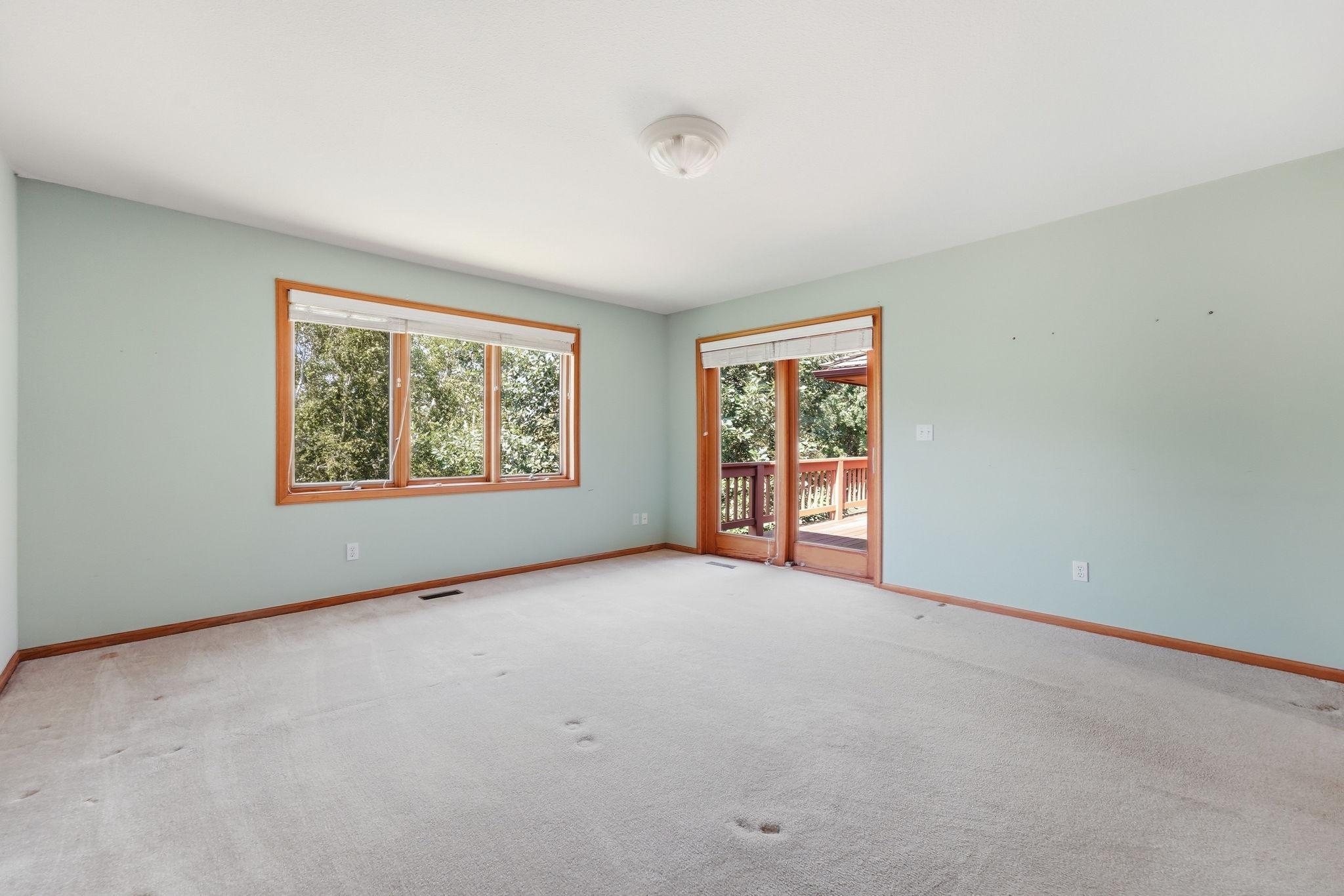 Primary Bedroom with walk out to the deck
