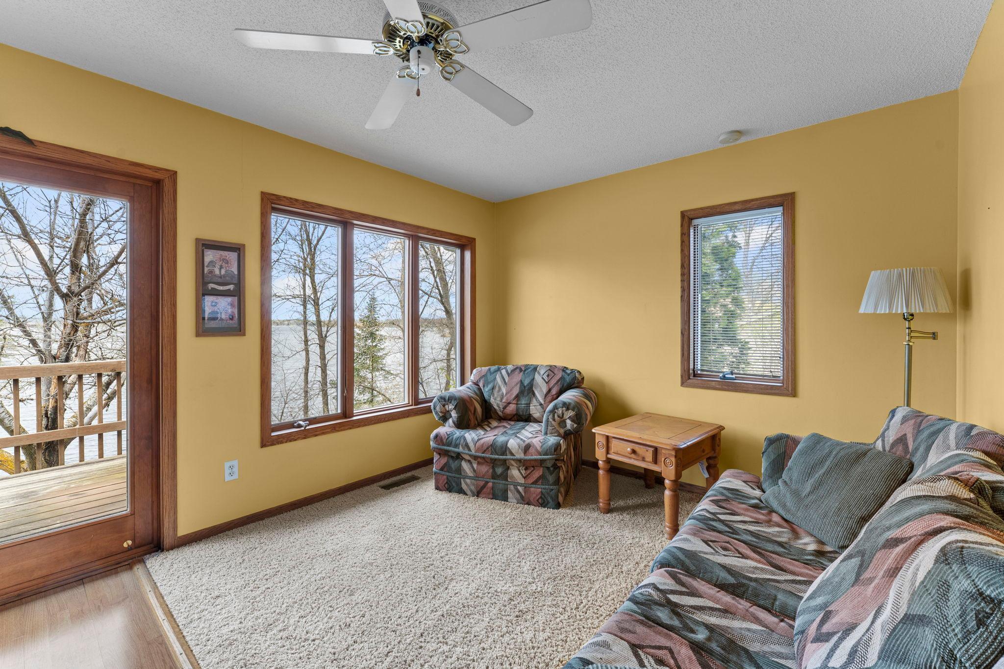 Comfortable living room and area for a small table to eat while looking out at the lake