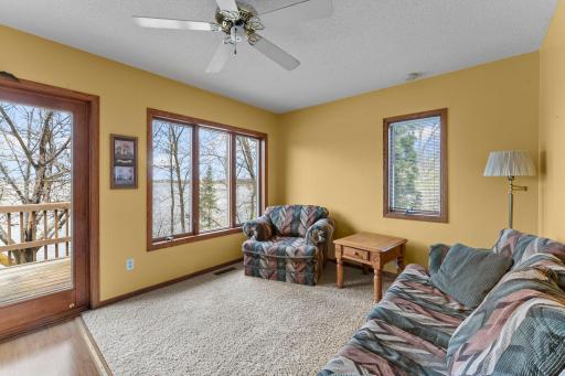 Comfortable living room and area for a small table to eat while looking out at the lake