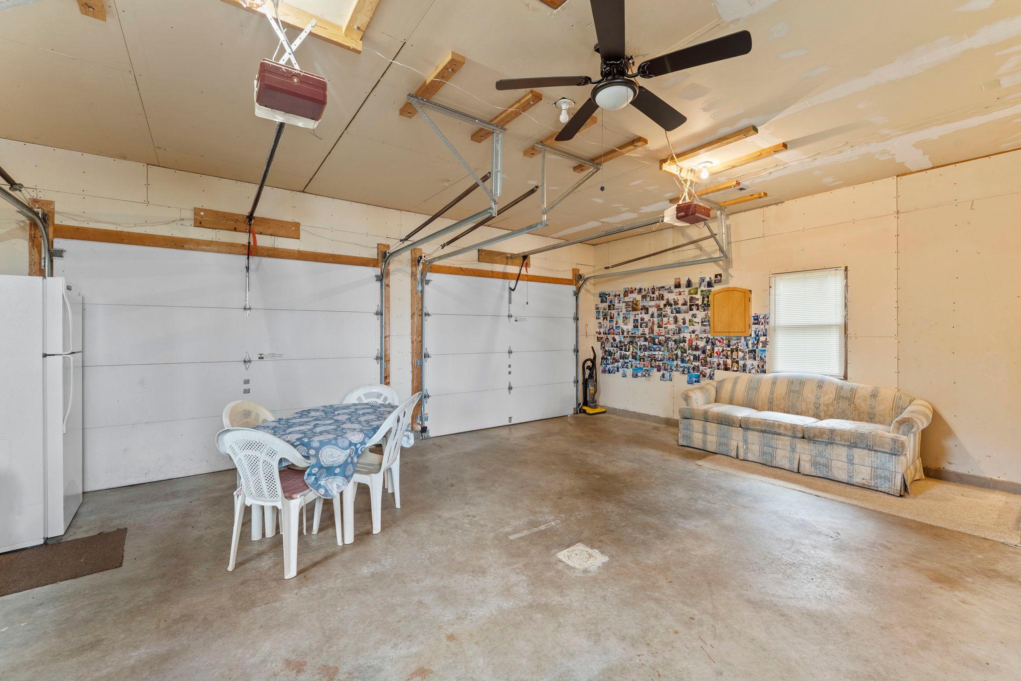 Large 24' wide garage - 2 nine ft wide insulated overhead doors.