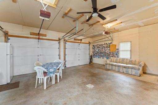 Large 24' wide garage - 2 nine ft wide insulated overhead doors.