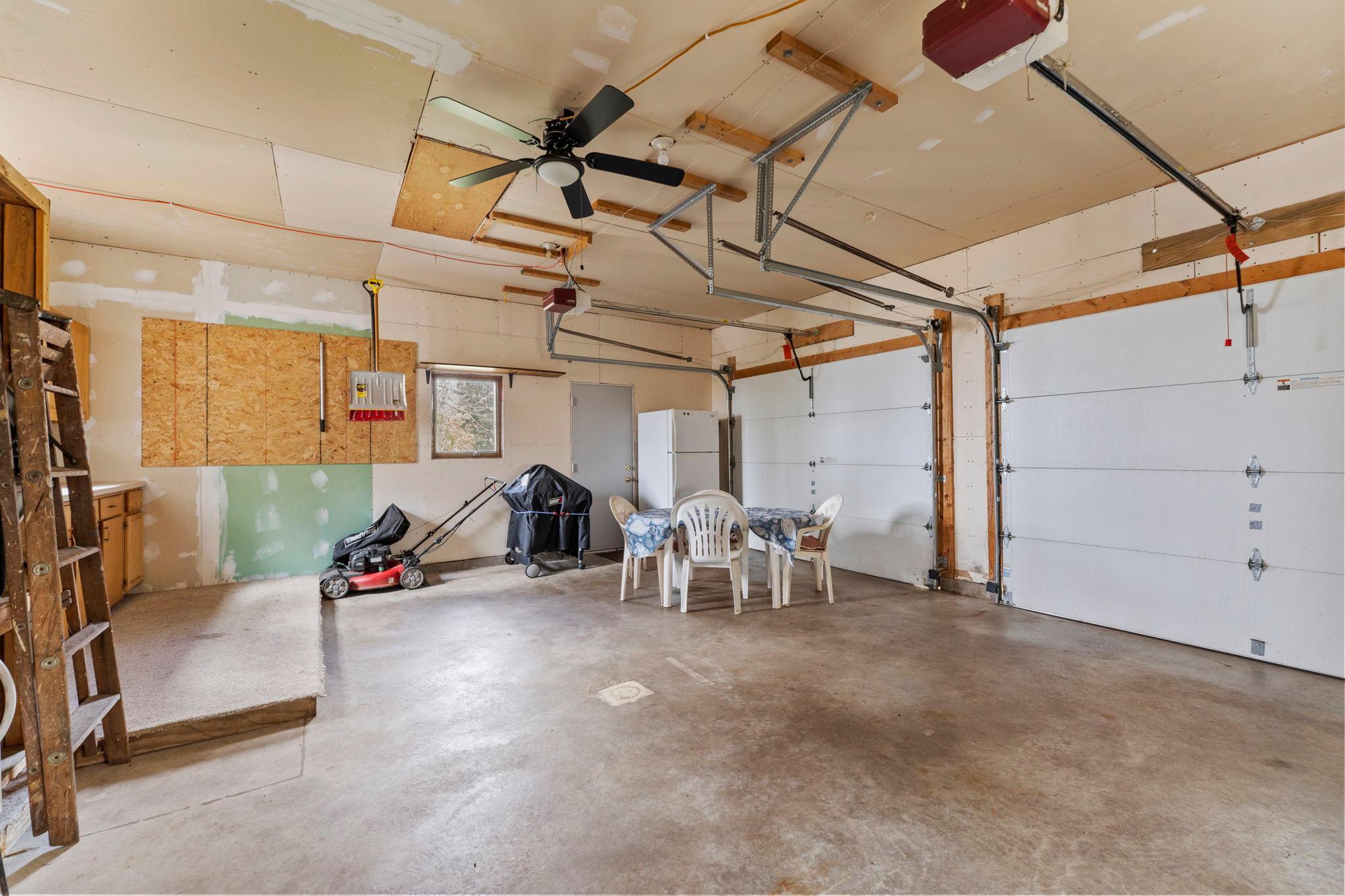 Garage can be used for storage or as a gathering spot for meals, entertaining, hanging out spot
