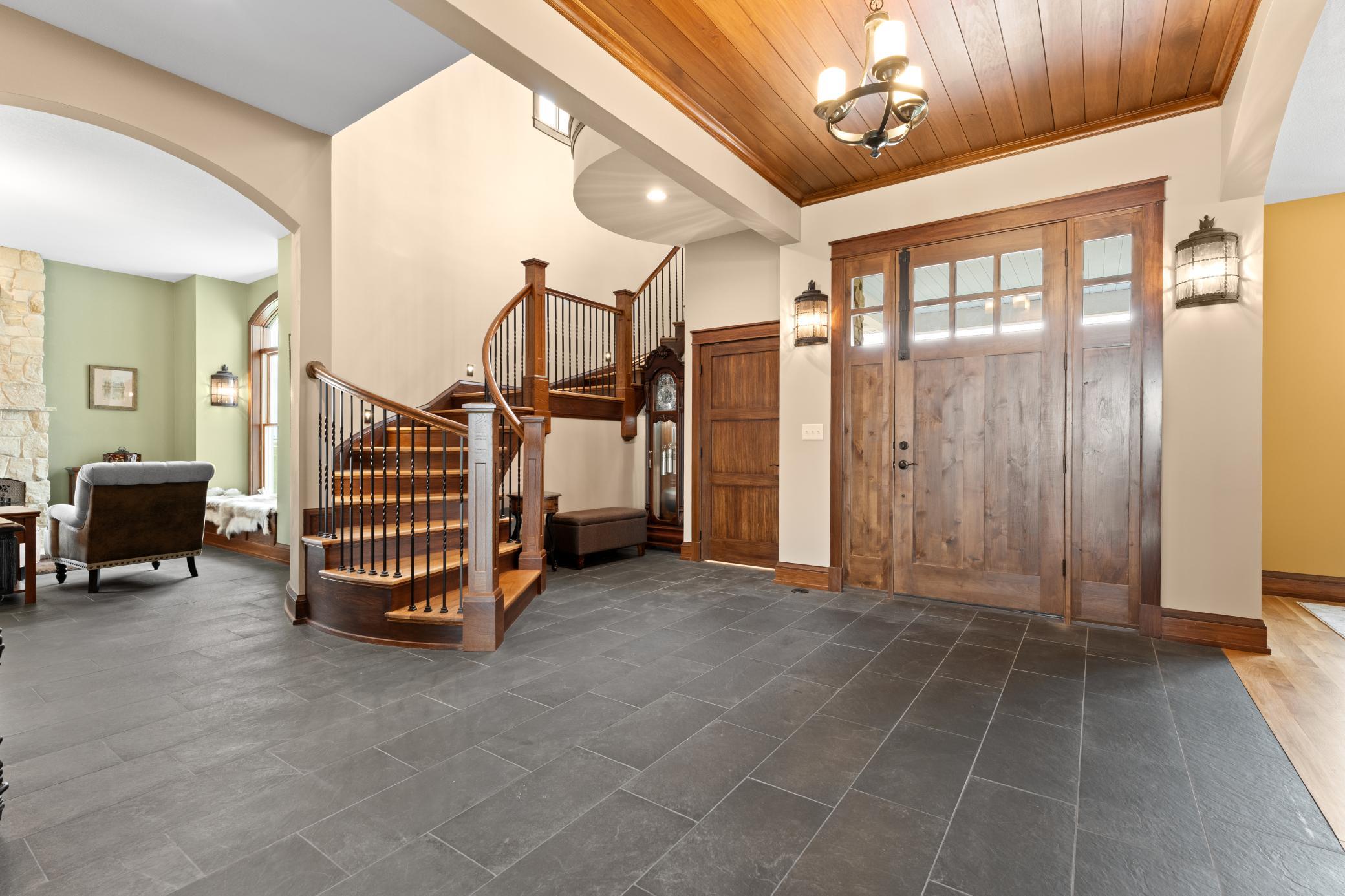 This commanding home features 5 bedrooms, 4 bathrooms and 5 garage spaces.
