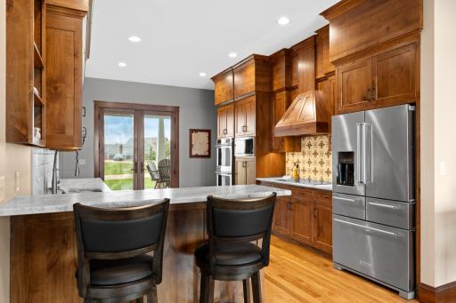 Kitchen features stainless steel appliances, alder cabinets and leathered granite countertops