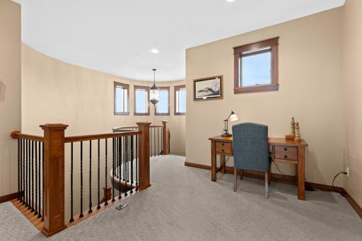 Custom oak and iron spiral staircase in the turret