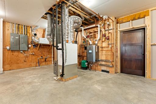 Instant hot water system feeds the in-floor heat and all hot water needs, high-velocity furnace systems heats the rest of the home