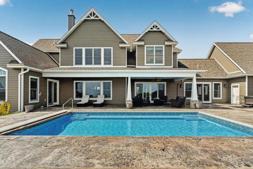 Heated, in ground saline pool with bench facing the view
