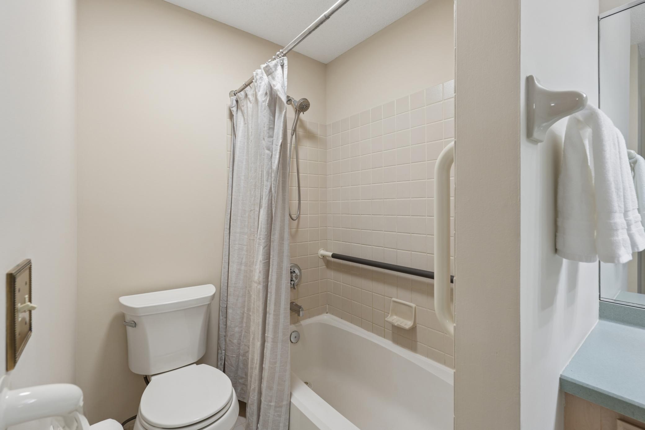 Full bathroom with tile shower and tub