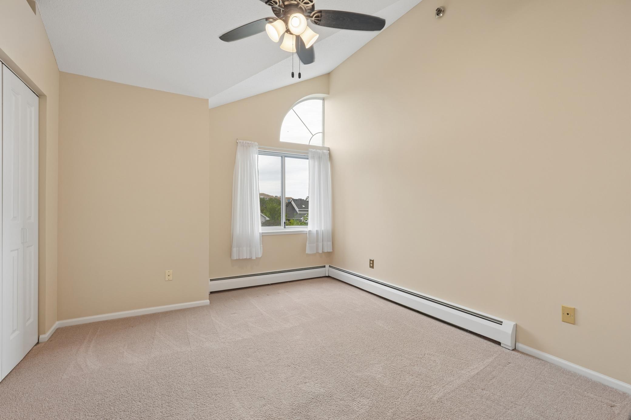 2nd bedroom with vaults & ceiling fan