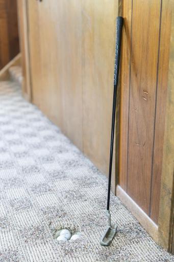 Golf putting practice hole in Amusement Room