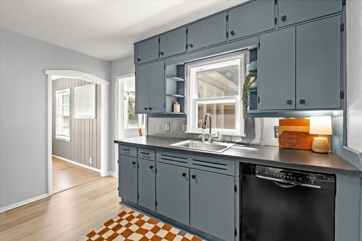 Freshly painted cabinetry in this sweet kitchen