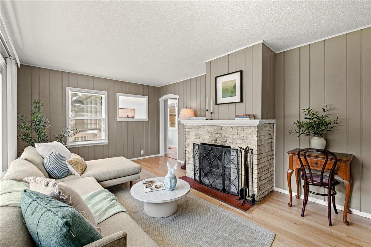 Charming living room with wood burning fireplace