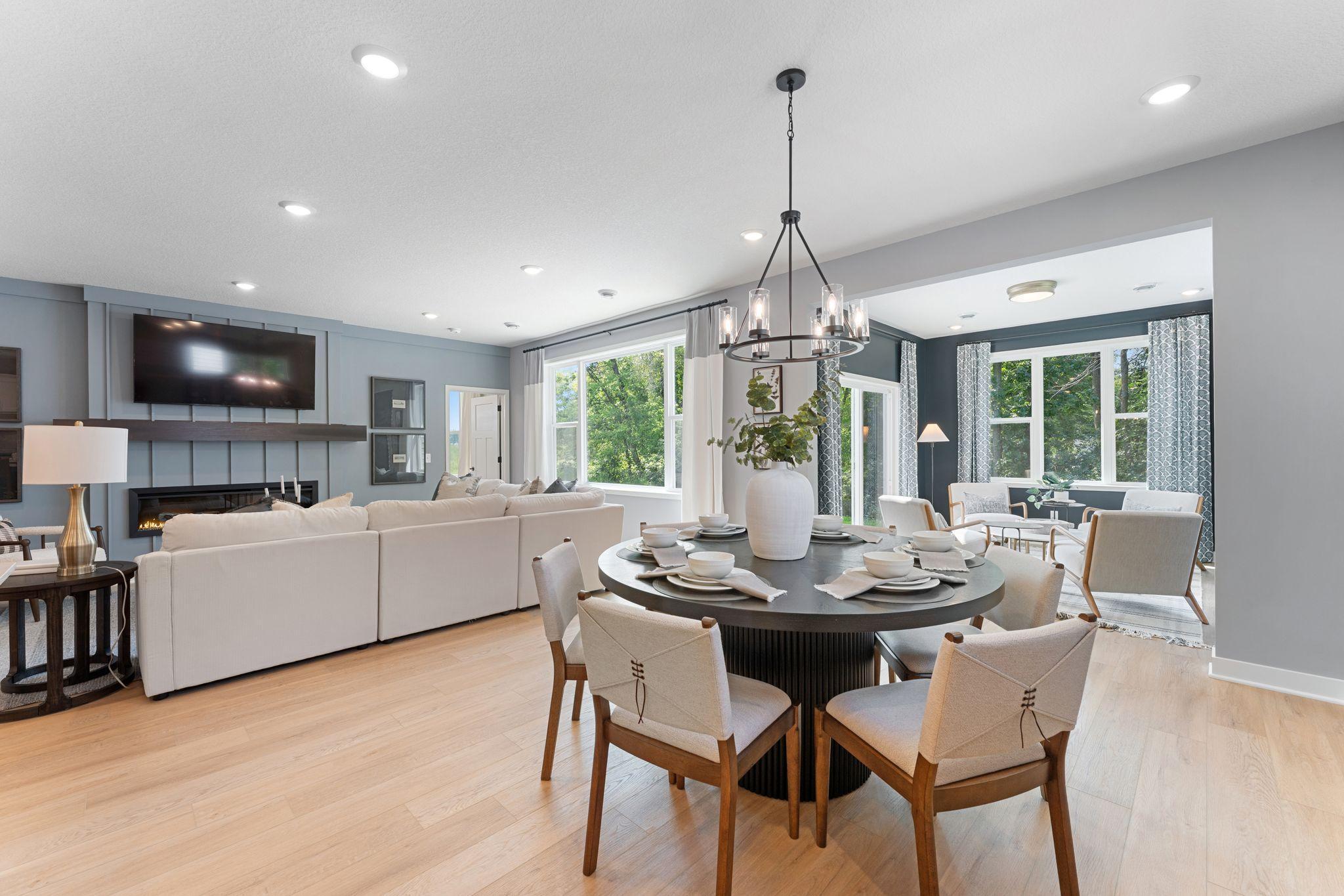 Open floor plan- enjoy the dining area and living spaces, and enjoy the morning room tucked just beyond....( representational)