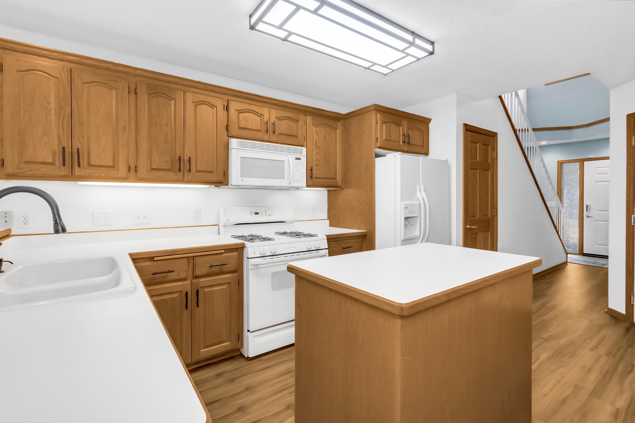 Kitchen with updated hardware and faucets