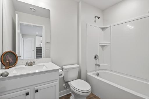Additional full bathroom on lower floor designed with comfort and functionality in mind.