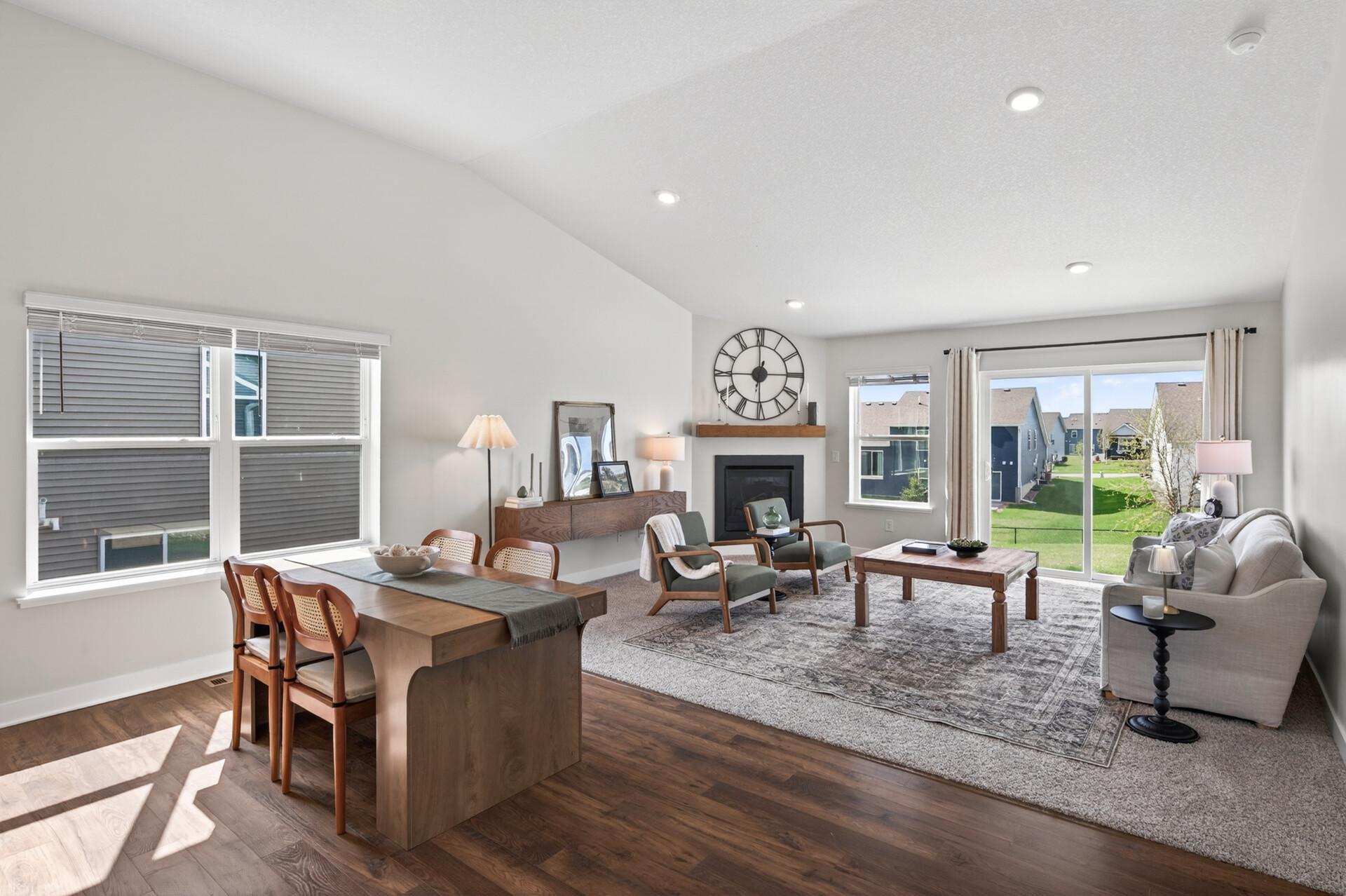 Bright and airy living room with vaulted ceilings and stunning backyard views.