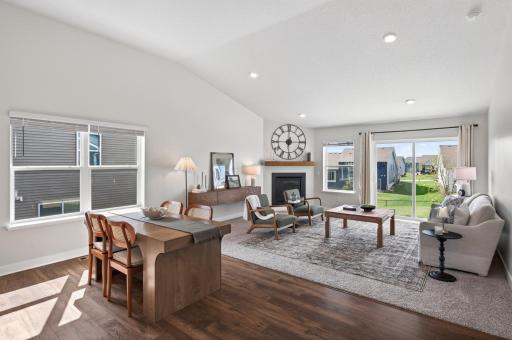 Bright and airy living room with vaulted ceilings and stunning backyard views.