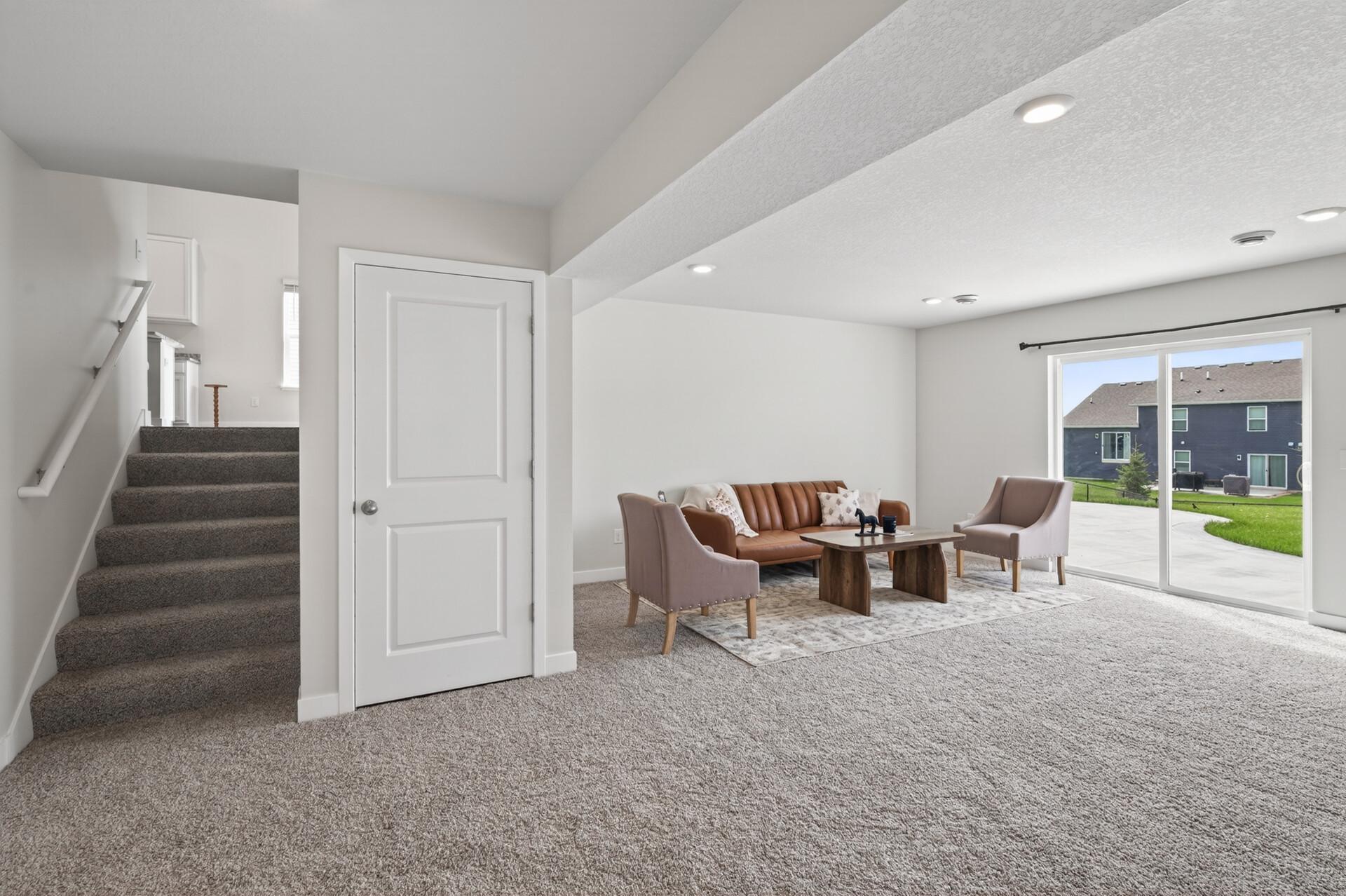 Expansive lower-level family room offering endless possibilities for entertainment or relaxation.