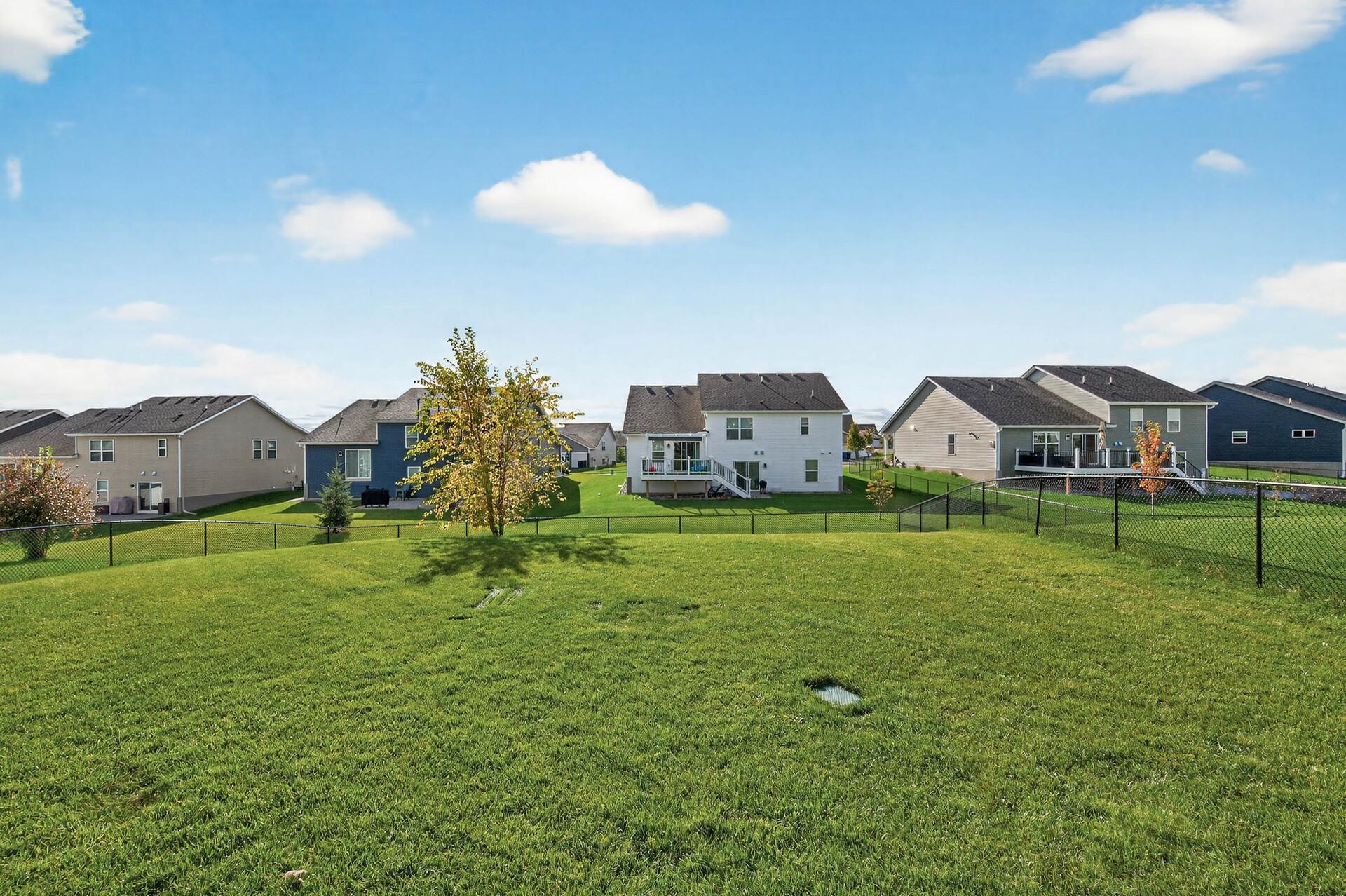 Fully fenced in backyard. Wide-open green space offering privacy and room to enjoy the outdoors..