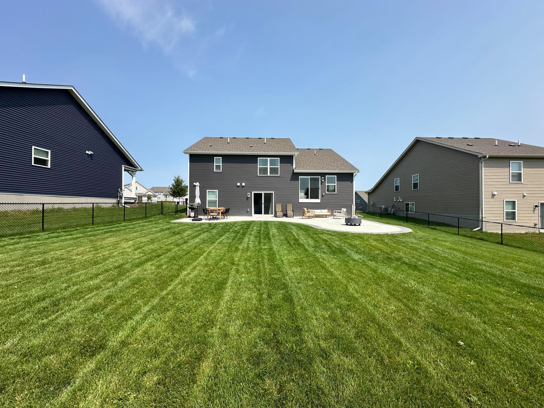 Expansive backyard offering endless possibilities for entertaining, play, or relaxation.