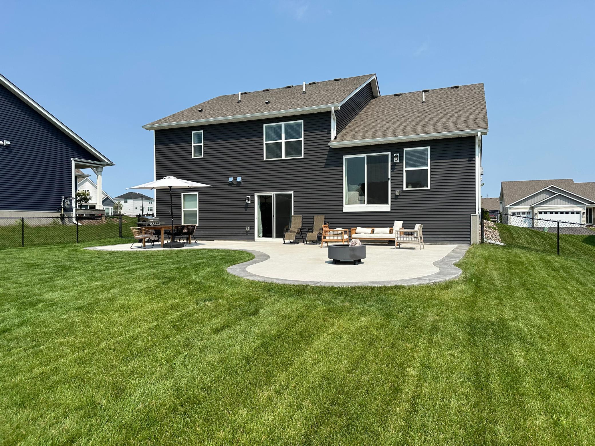 Backyard patio ideal for summer BBQs, outdoor dining, and relaxing evenings.