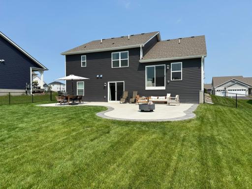 Backyard patio ideal for summer BBQs, outdoor dining, and relaxing evenings.