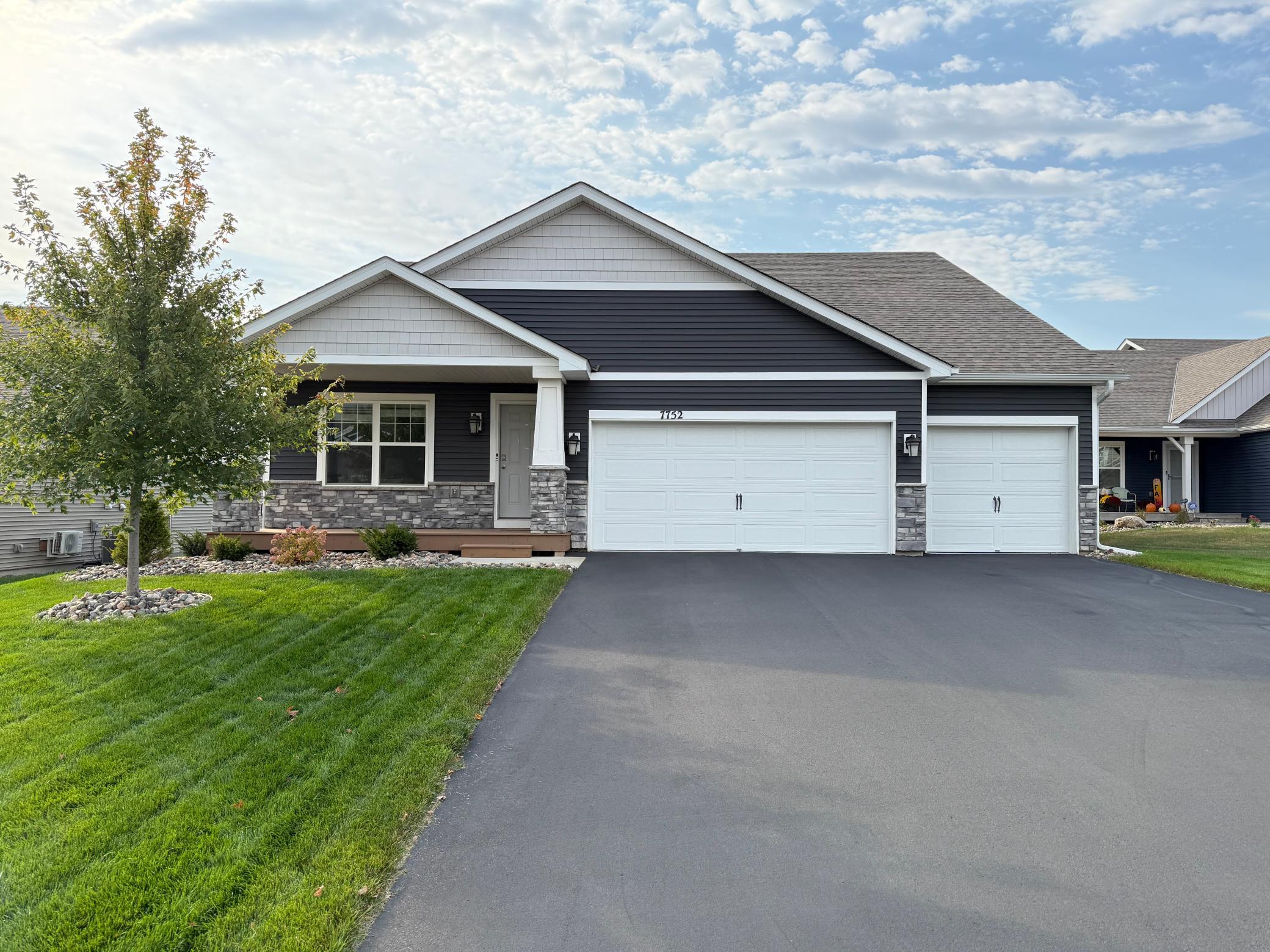 Charming exterior with a spacious 3-car garage and beautiful curb appeal.