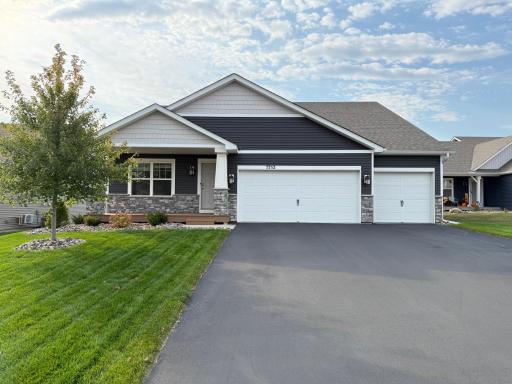 Charming exterior with a spacious 3-car garage and beautiful curb appeal.