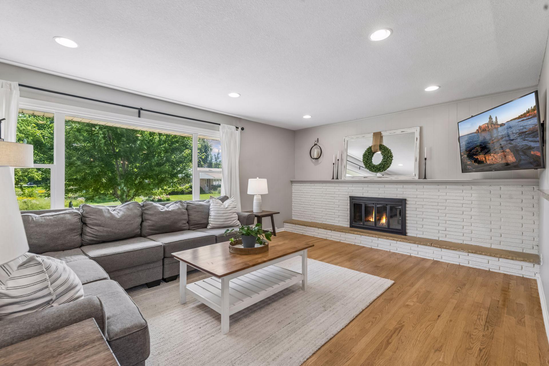 Wood burning fireplace with white brick surround