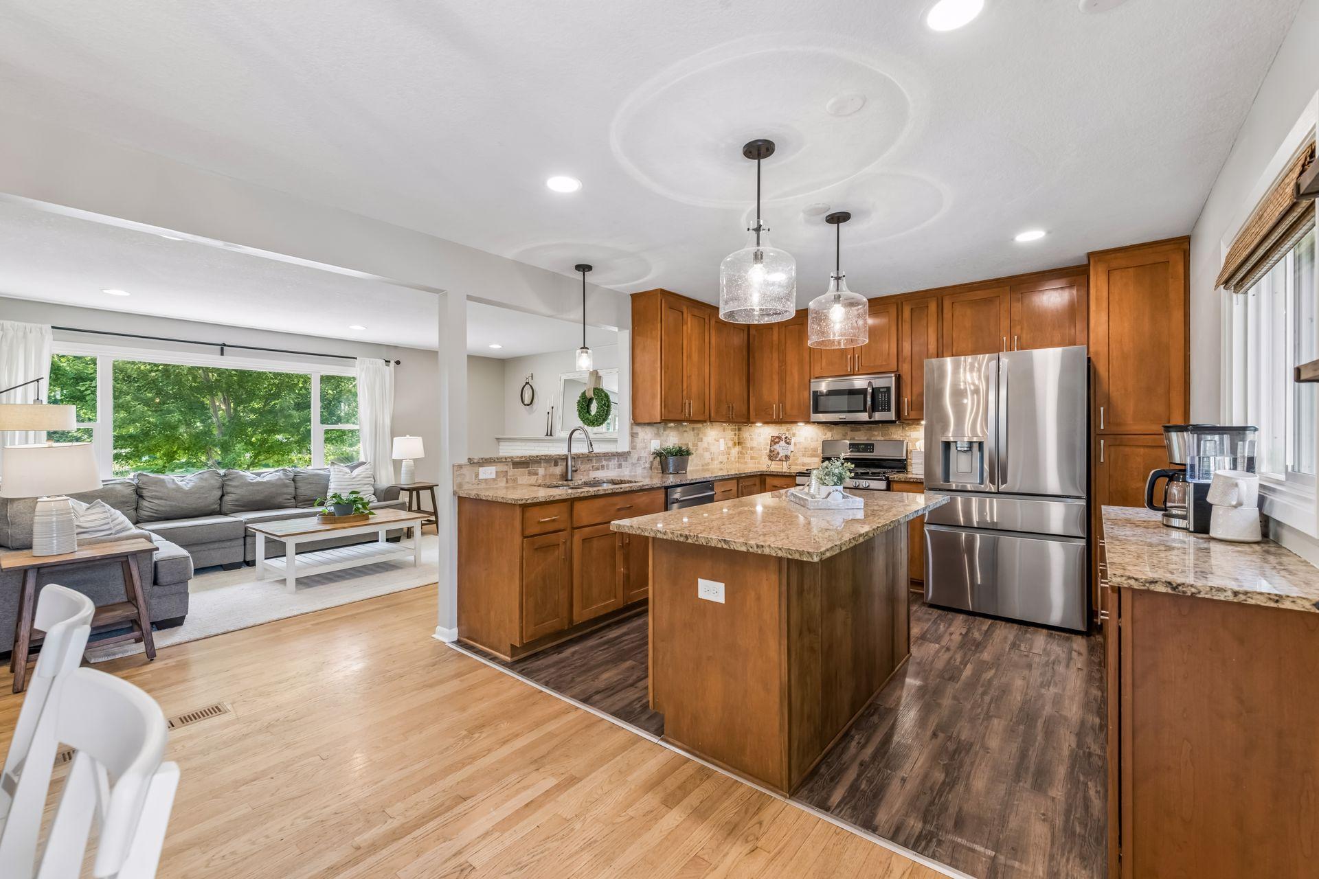 Open concept main level features kitchen, living and dining room