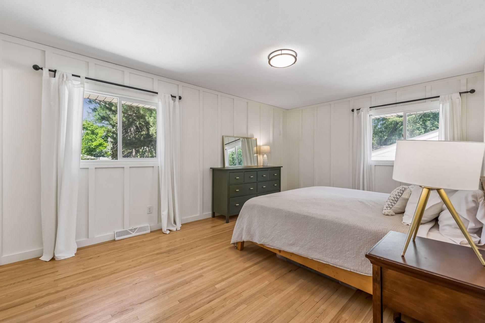 Spacious primary features board and batten walls and lots of natural light